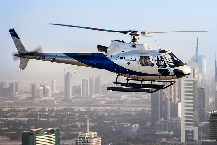 Experience breathtaking views of Dubai's skyline from above gliding through the air on a luxury helicopter tour. A unique way to appreciate the city's stunning architecture and landscapes.
